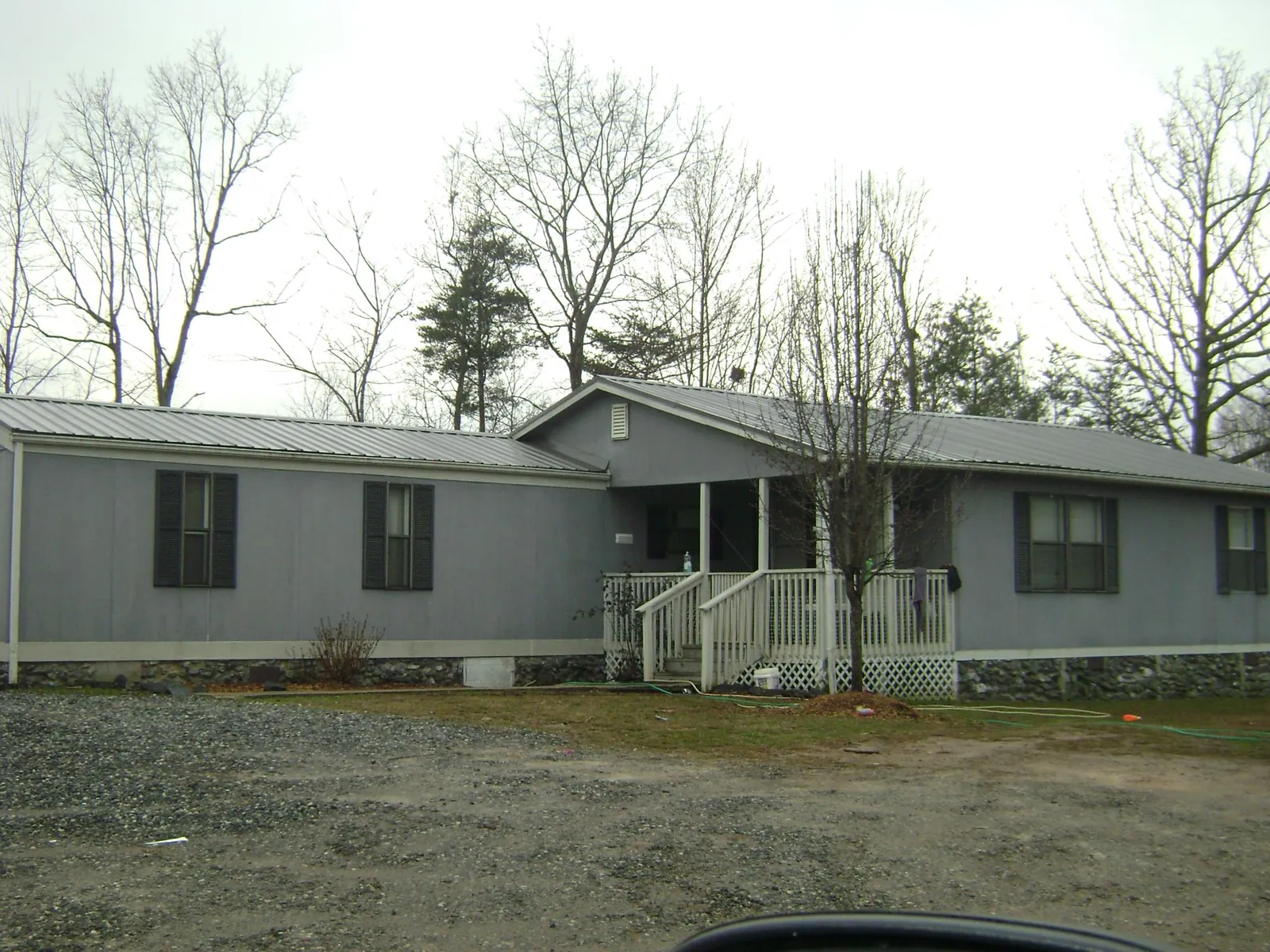 Metal roof over a manufactured home with a covered front porch in Gardner